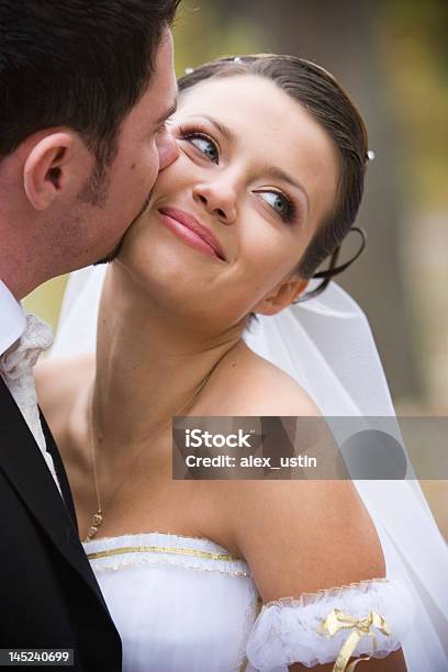 Bride And Groom Share A Kiss Stock Photo - Download Image Now - Adult, Adults Only, Beautiful People