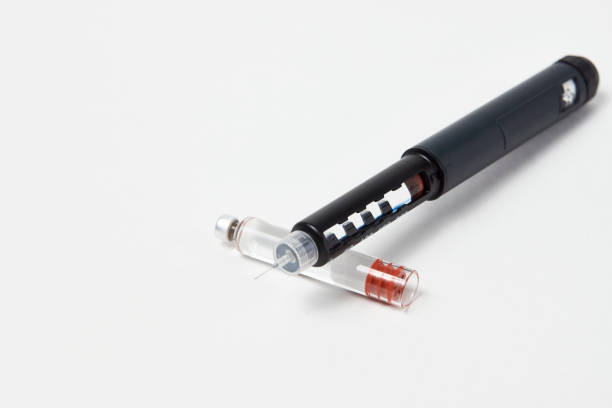istock Insulin pen with insulin medicine on white background 1452411191
