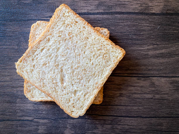 istock Wheat bread ready to eat on the wooden background 1452412166
