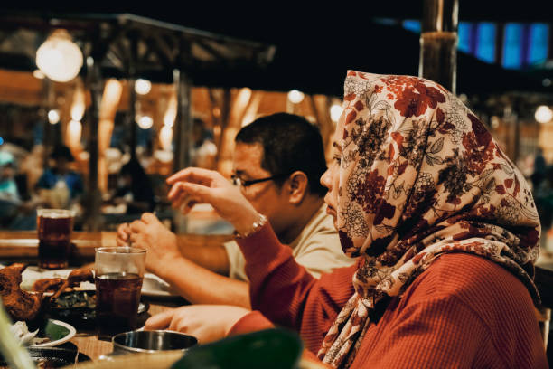 istock Family enjoying dinner in restaurant 1452415525