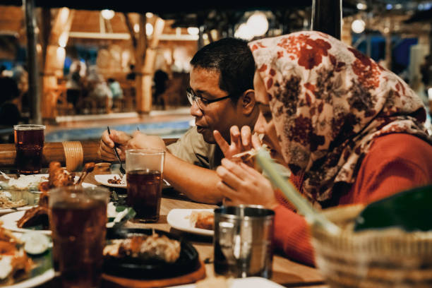 istock Family enjoying dinner in restaurant 1452415529