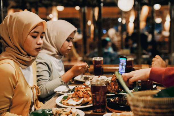 istock two woman  enjoying dinner in restaurant 1452415546
