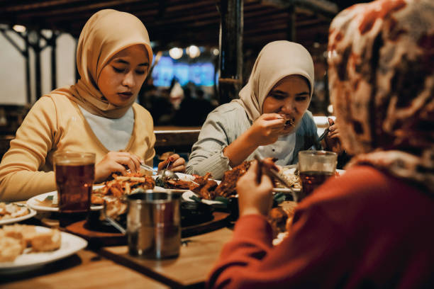 istock Family enjoying dinner in restaurant 1452415557
