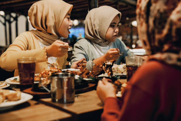 istock Family enjoying dinner in restaurant 1452415571