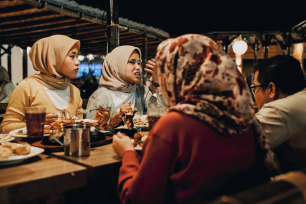 istock Family enjoying dinner in restaurant 1452415573