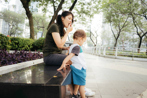 istock asian family playing in the public park 1452416475