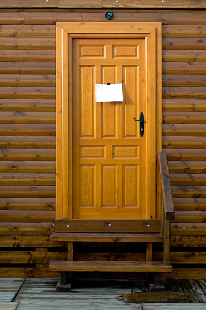 istock Rustic wooden door with a sign blank 145241685