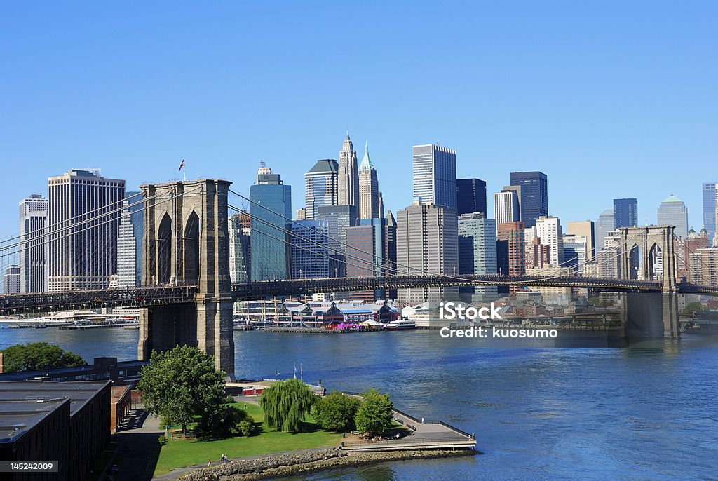 New York City Skyline New York City and the Brooklyn Bridge on a clear blue day Architecture Stock Photo