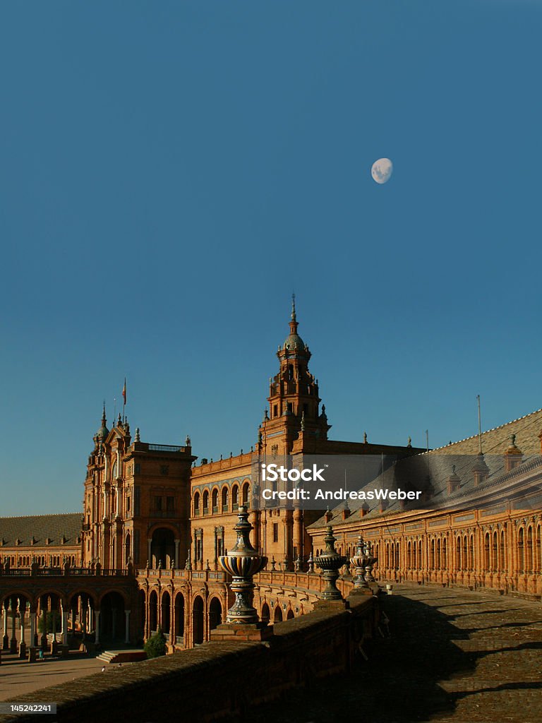 Spanish Steps in Seville Plaza de EspaAa in Sevilla (Spain) with the moon at a deep blue sky Andalusia Stock Photo
