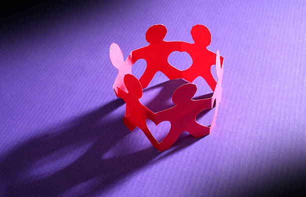 istock Paper chain people standing in a circle  145242481