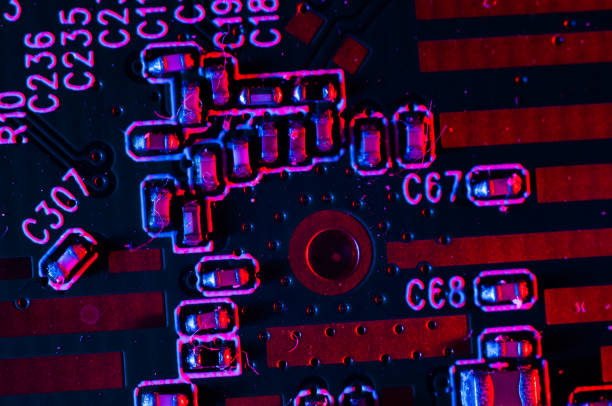 istock Circuit board close-up in vivid red and blue 1452425784