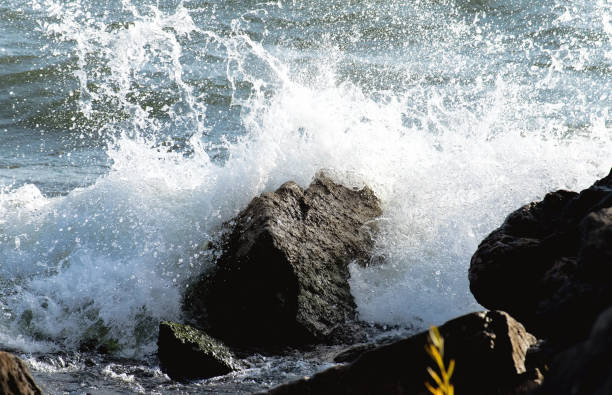 Rough Waves Crashing Upon Rocks stock photo