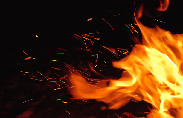 Orange and Yellow Fire Sparks at Night stock photo