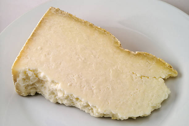 Aged cheese: castelmagno slice stock photo