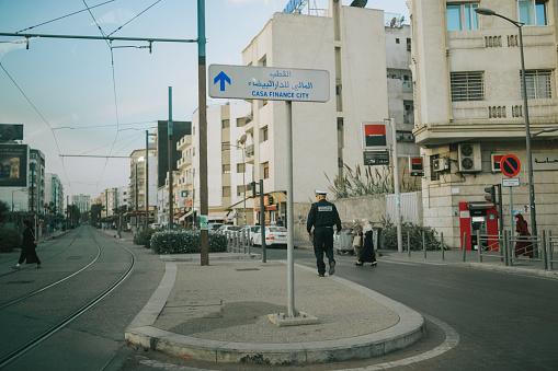 Traffic Police walking at city street of Casablanca, Morocco road intersection on November 14th year 2022