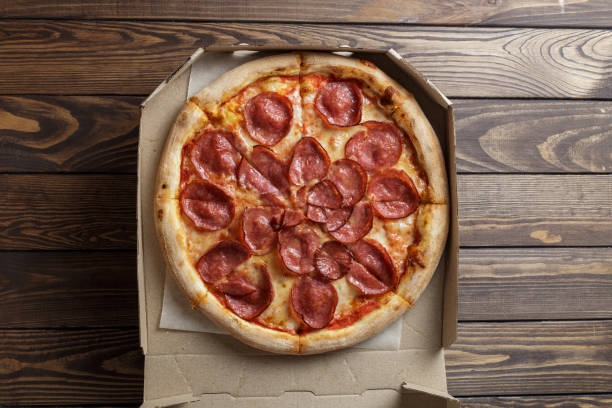 istock pepperoni pizza on wooden background 1452436094