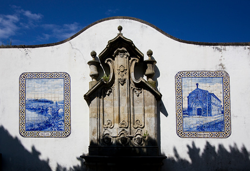 Typical stone fountain, traditional tile decoration in Vila do Conde, Portugal