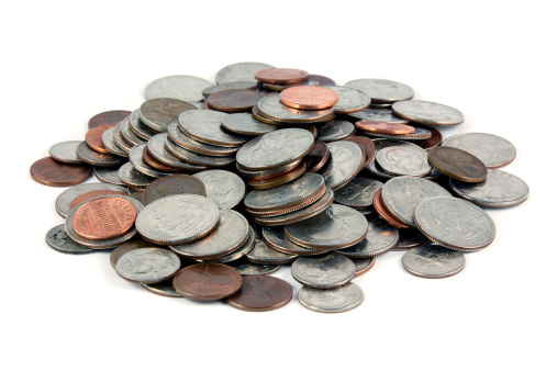 A pile of US Coins shot on a white background