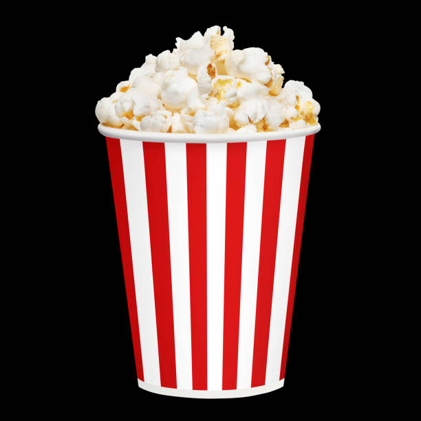 istock Delicious popcorn in red striped carton cup on black 1452440901