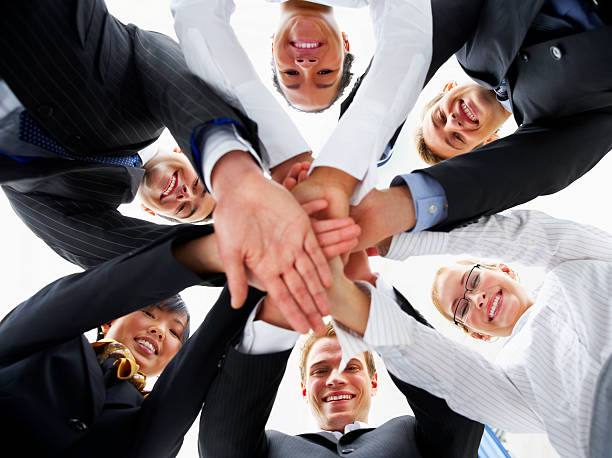istock Business people joining their hands 145244444