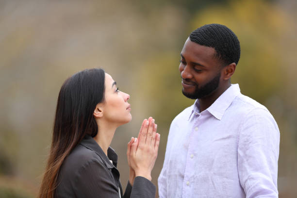 Woman begging forgive to a black man Woman begging forgive to a black man jealous ex girlfriend stock pictures, royalty-free photos & images