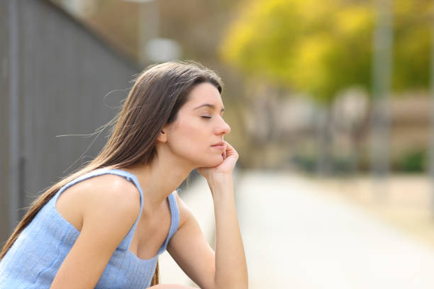 istock Teen relaxing in a park 1452445091