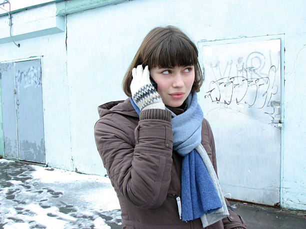 Young lady is holding a mobile phone