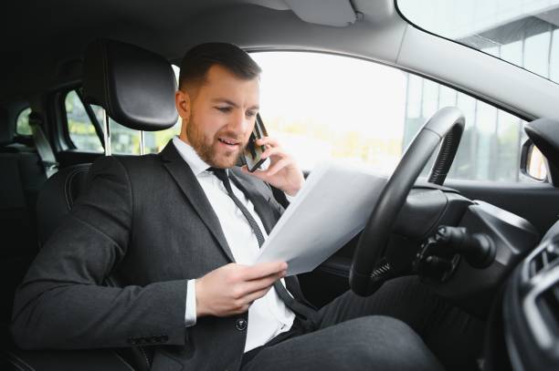 istock Attractive elegant happy man in good car 1452449180