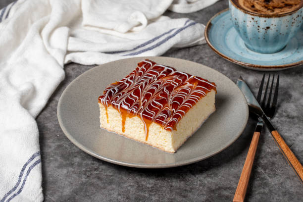 istock Trilece cake slice on dark background. Milk and caramel cake. Bakery products. Mexican sweets. close up 1452449887