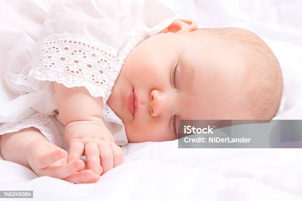 Cute Little Baby Peacefully Sleeping With Hands Together Stock Photo - Download Image Now