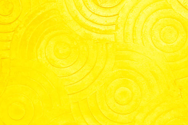istock Yellow concrete texture wall background. Abstract orange paint floor stamped concrete surface clean polished on walkway in garden. Wallpaper pattern curved circle rough orange cement stone decorative 1452453369