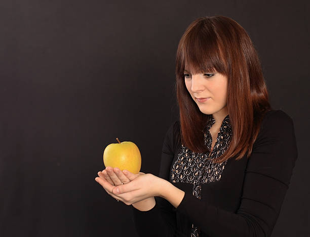 istock The girl with an apple 145245367