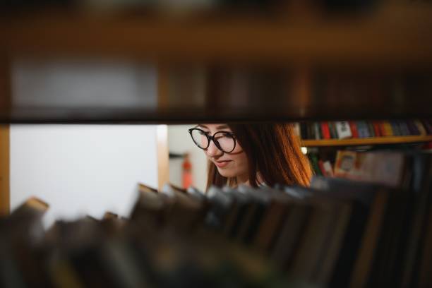 istock Portrait of a student girl studying at library 1452453972