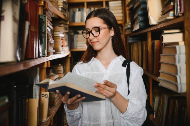 istock Portrait of a beautiful student in a library 1452455560