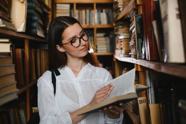istock Portrait of a student girl studying at library 1452455587