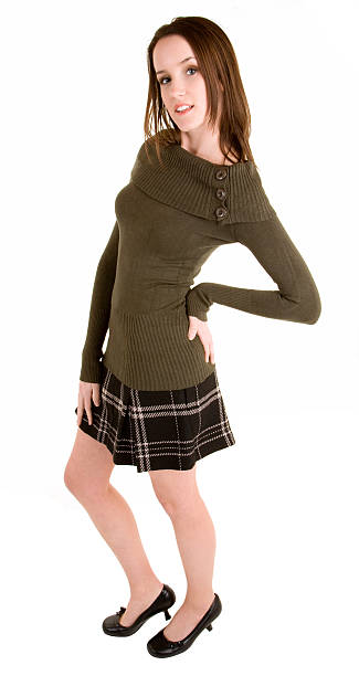 istock Beautiful Brunette in a Plaid Skirt and Sweater 145245634