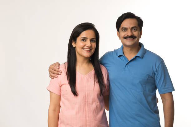 istock Happy Indian couple with arms around 1452456702