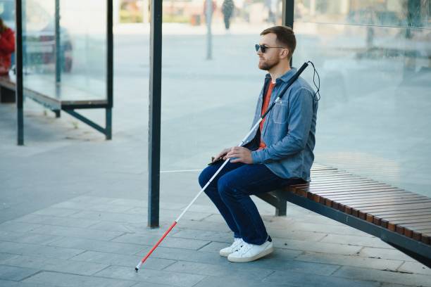 istock Blinded man waiting for bus at a bus station 1452456808