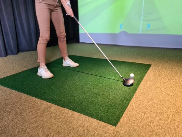 istock Girl golf player plays golf indoors closeup 1452457495