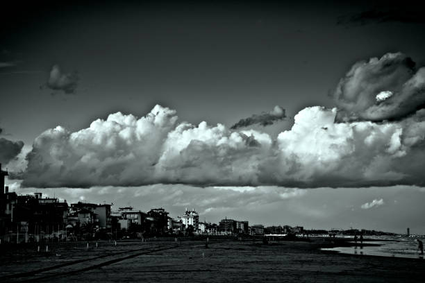 istock a big cloud in black and white over a beach 1452458716