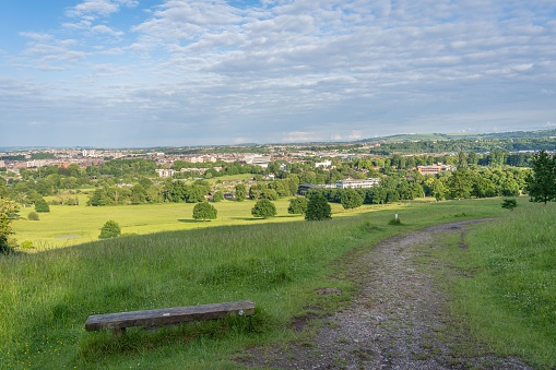 A wooden bench with the city in the background, Bristol, England, United Kingdom