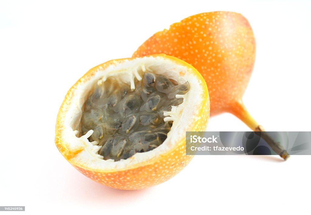 passion fruit A beautiful ripe granadilla cut in half - isolated over white background Cross Section Stock Photo