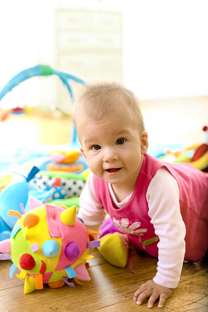 istock Baby Girl Playing At Home 145246005