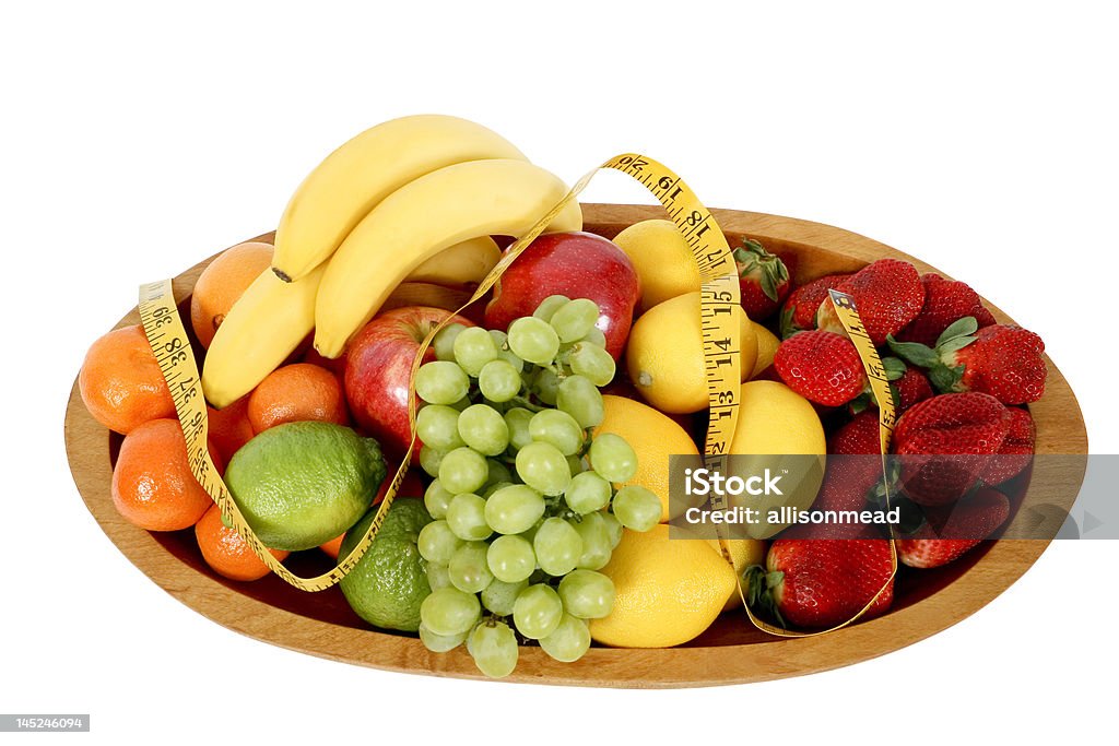 Bowl mezcla de frutas con cinta métrica - Foto de stock de Alimento libre de derechos