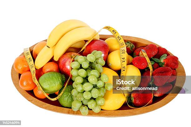 Bowl Mezcla De Frutas Con Cinta Métrica Foto de stock y más banco de imágenes de Alimento - Alimento, Amarillo - Color, Cinta métrica