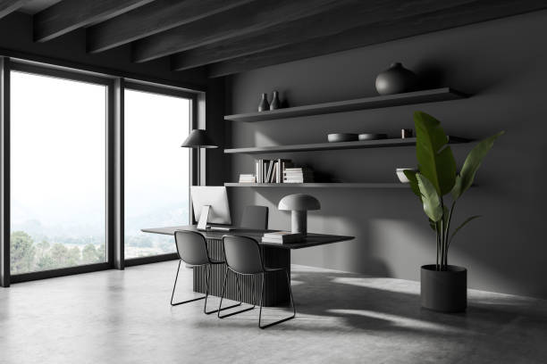 istock Grey business interior with desk and pc computer, shelf with panoramic window 1452463055