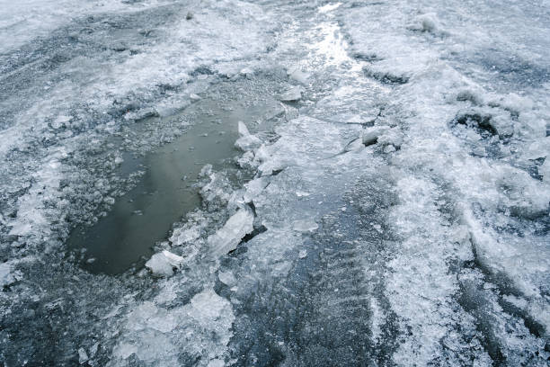 istock Winter frozen dirt road with ice 1452463904