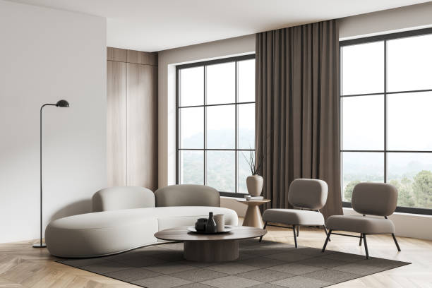 istock Stylish living room interior with couch and art decor, panoramic window 1452464034