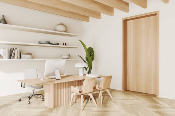 istock Office interior with work table and armchairs, shelf with decoration 1452465695