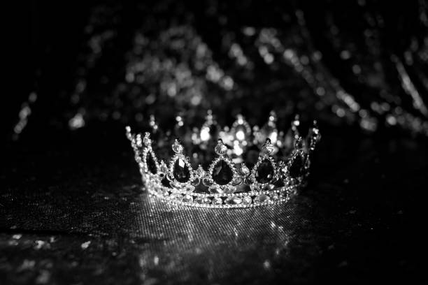 istock Golden vintage crown with blue gemstones. Sapphire. Black and white. 1452467390